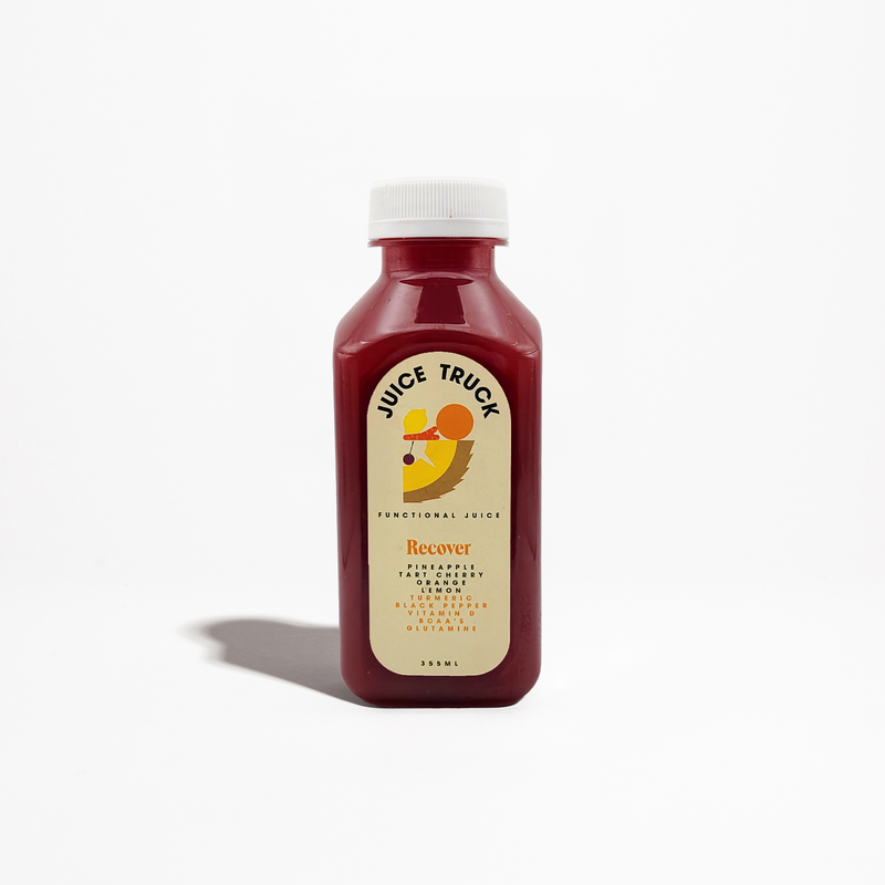 A reddish orange bottle of 'Juice Truck Recover' juice with a white cap on a plain background.