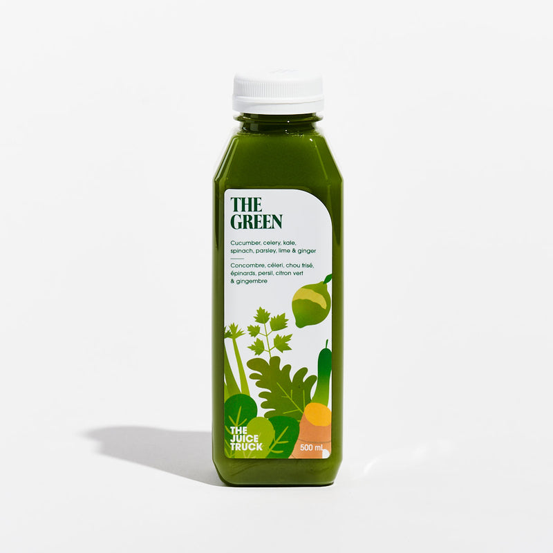 A bottle of juice labeled 'THE GREEN' with illustrations of a cucumber, celery, kale, and ginger, indicating the ingredients of the juice.