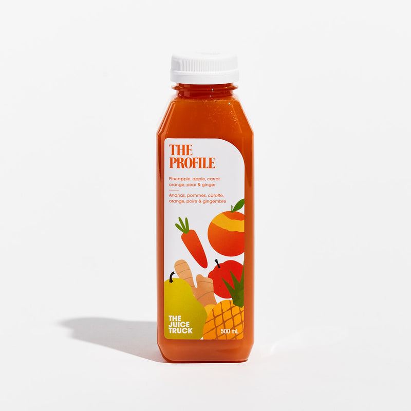 A bottle of juice labeled 'THE PROFILE' with illustrations of a pineapple, apple, carrot, orange, pear, and ginger on the label.